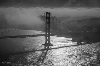 Black and white Golden Gate Bridge on a foggy morning.