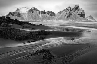 Mount Vestrahorn stands out as a striking presence on the Stokknes Peninsula on the South Coast of Iceland. 