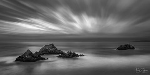 Black and white photo of sea stacks off the coast of San Francisco.