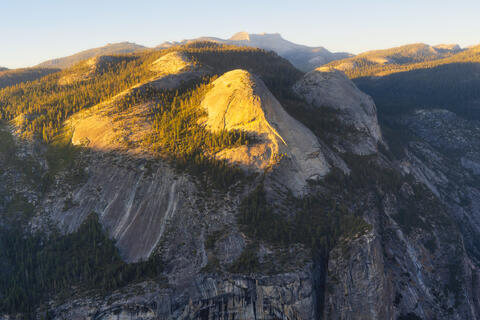 Yosemite National Park viewed from Glacier Point with granite cliffs and forested valley below