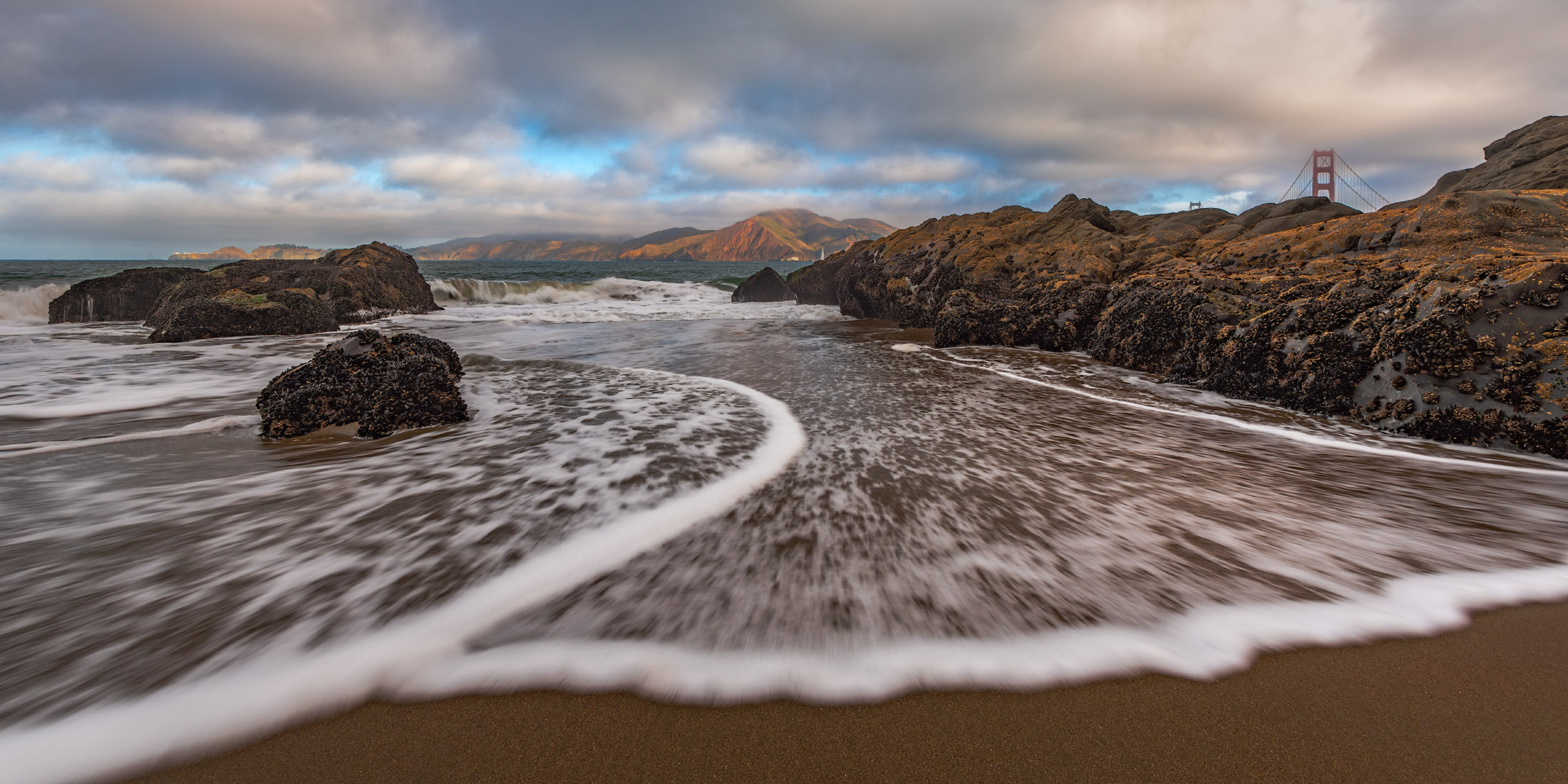 Baker Beach in San Francisco with a partial view of the Golden Gate Bridge