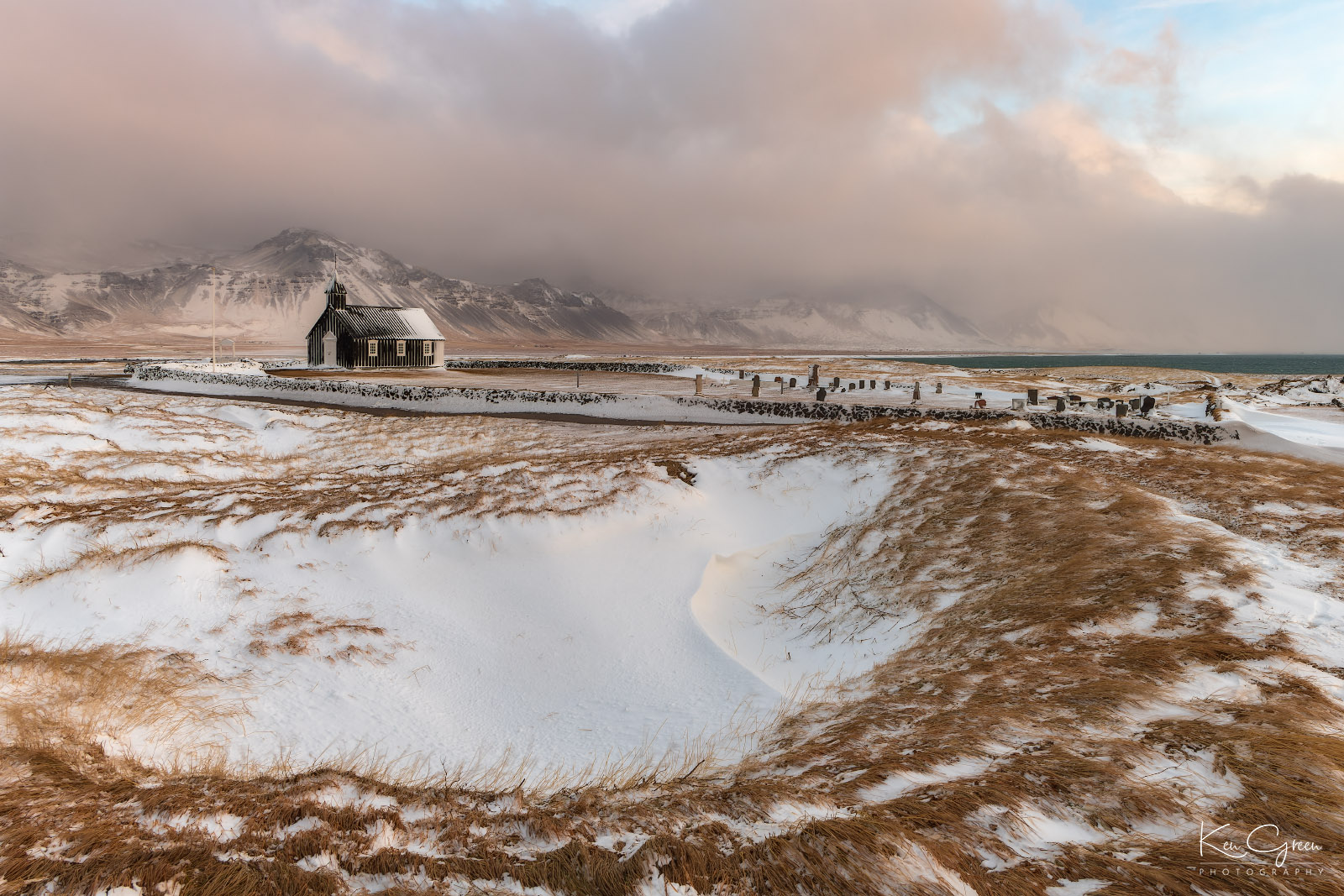 The Budir Black church and cemetery grounds on the Snaefellsnes Peninsula in Iceland.