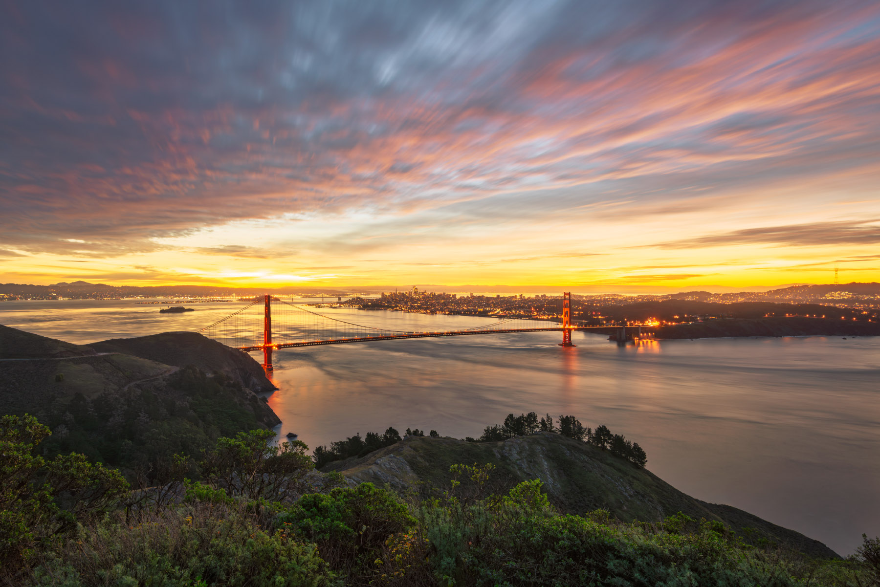 San Francisco and the Bay Area awaken as the sky and clouds light up during sunrise. 