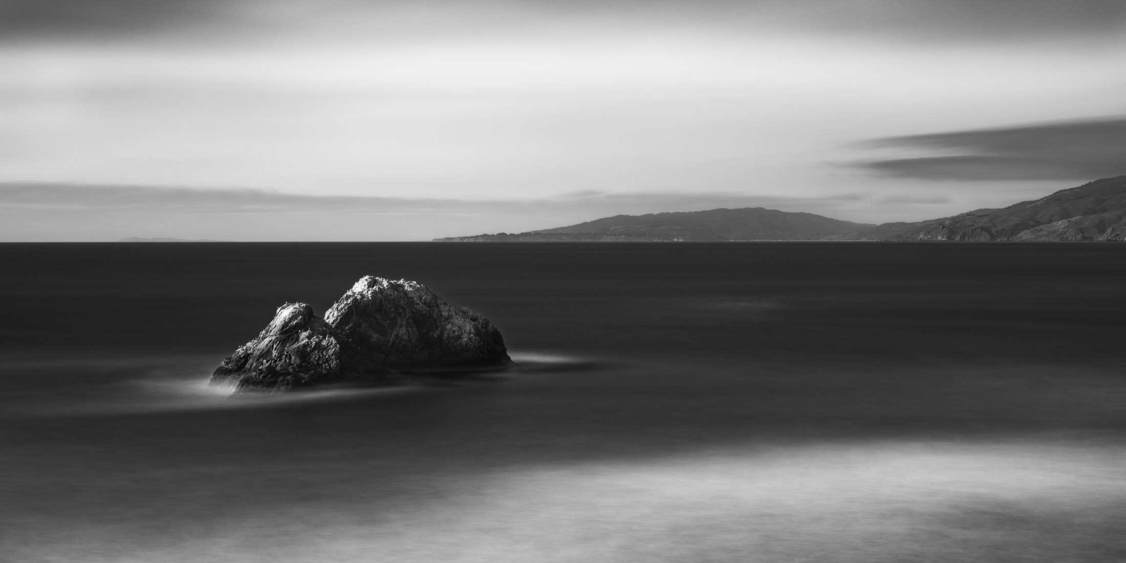 Black and white photo of sea stack off the coast of San Francisco