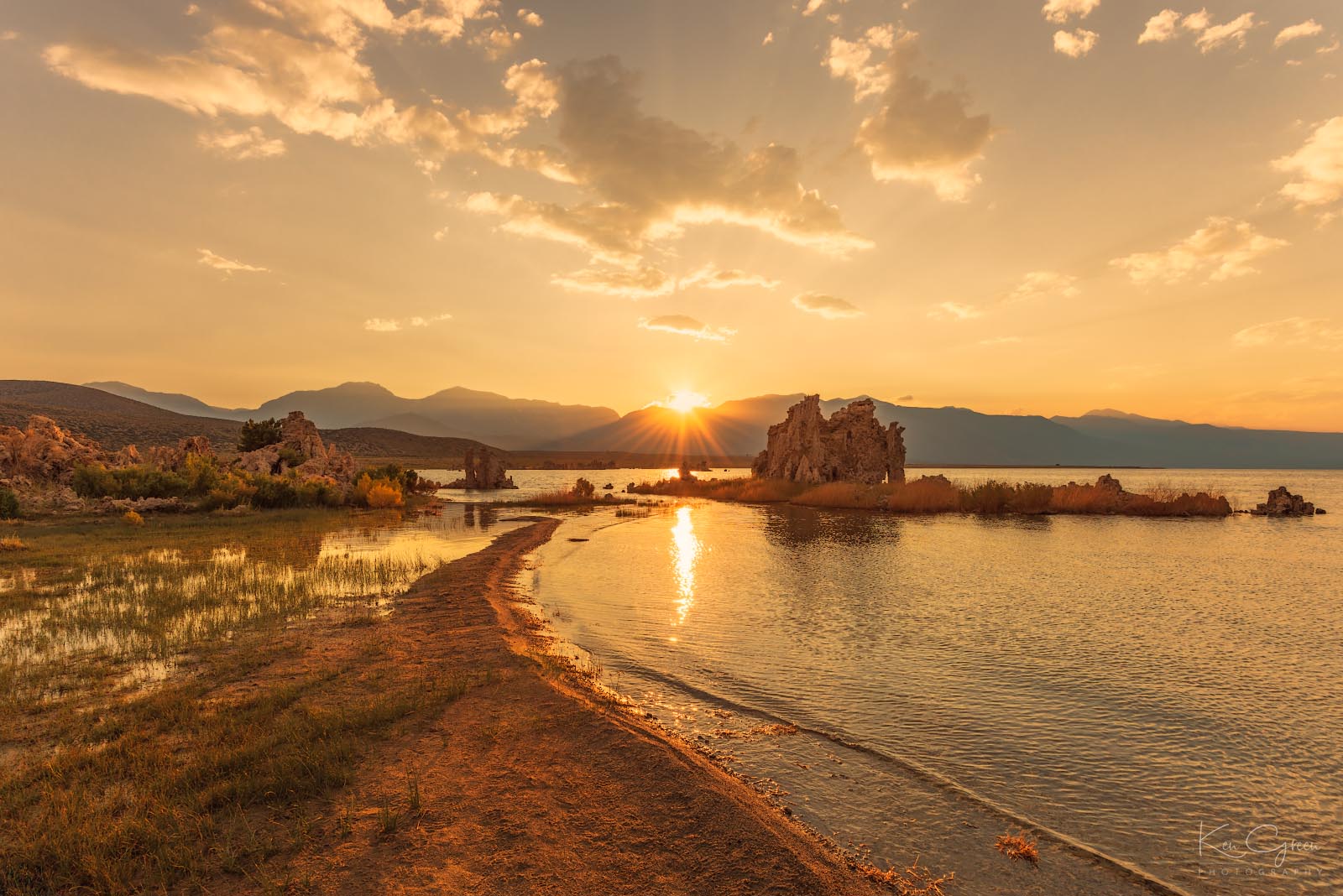 Mono Lake is calm and peaceful as the Sierra Nevada mountains is given a little kiss at sunset.